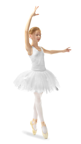 Young beautiful ballerina dancer posing on light background